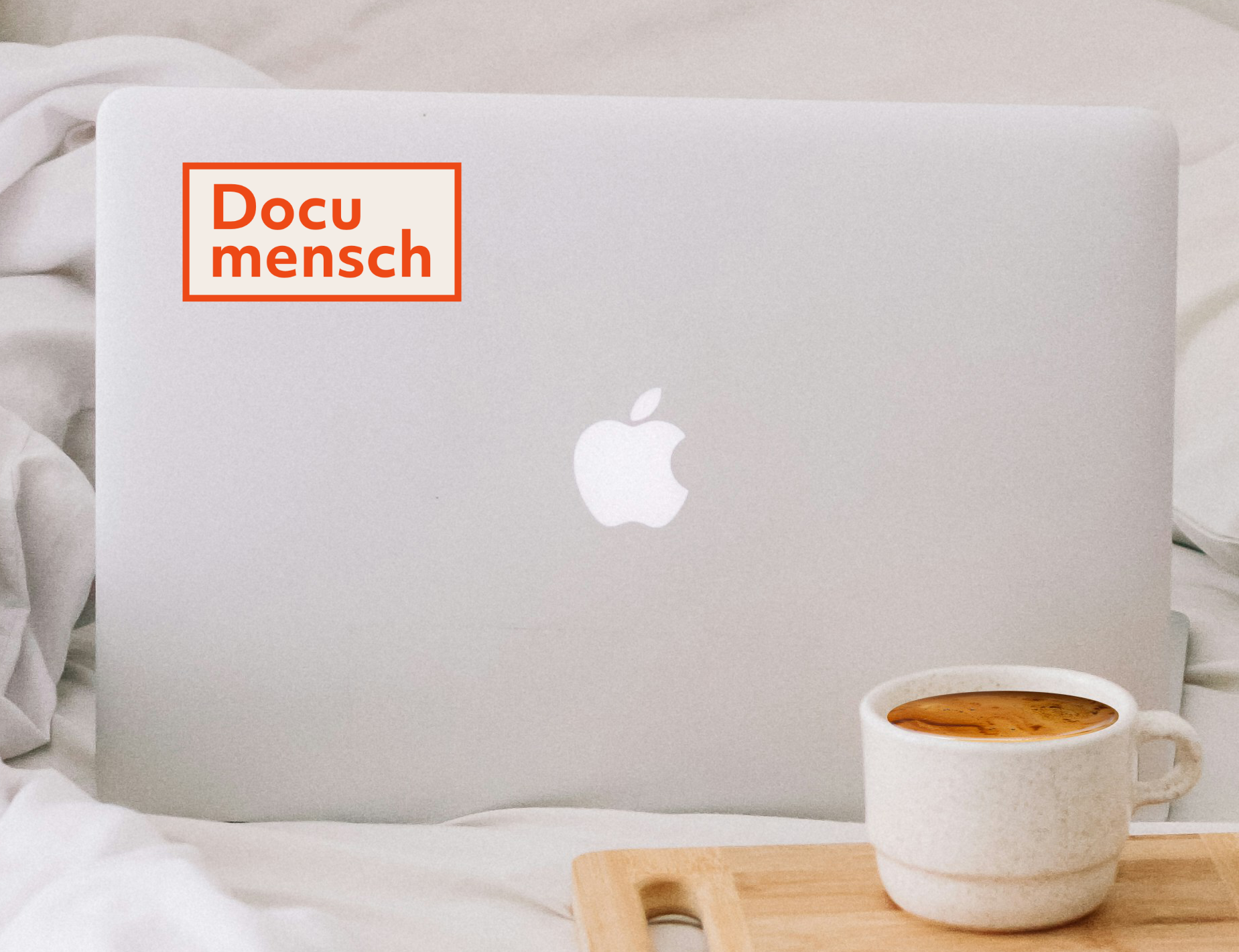 Documensch sticker on a laptop